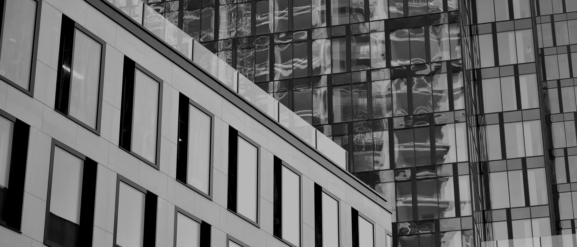 A repeating grid of windows across a building facade